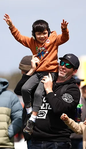 Child on mans shoulder